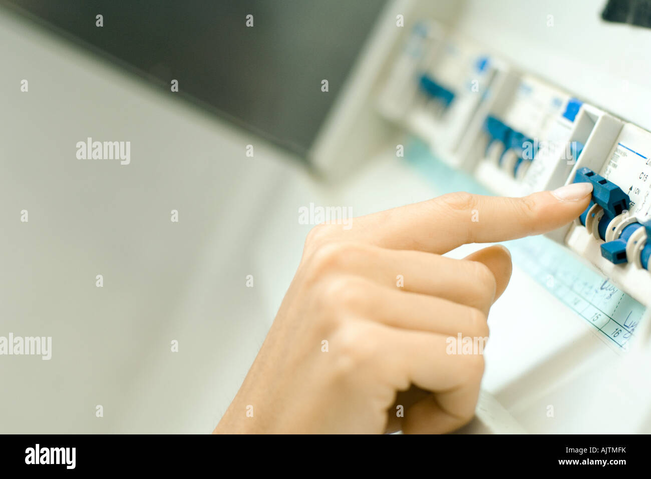 Woman switching fuse in fuse box, closeup of hand Stock Photo Alamy