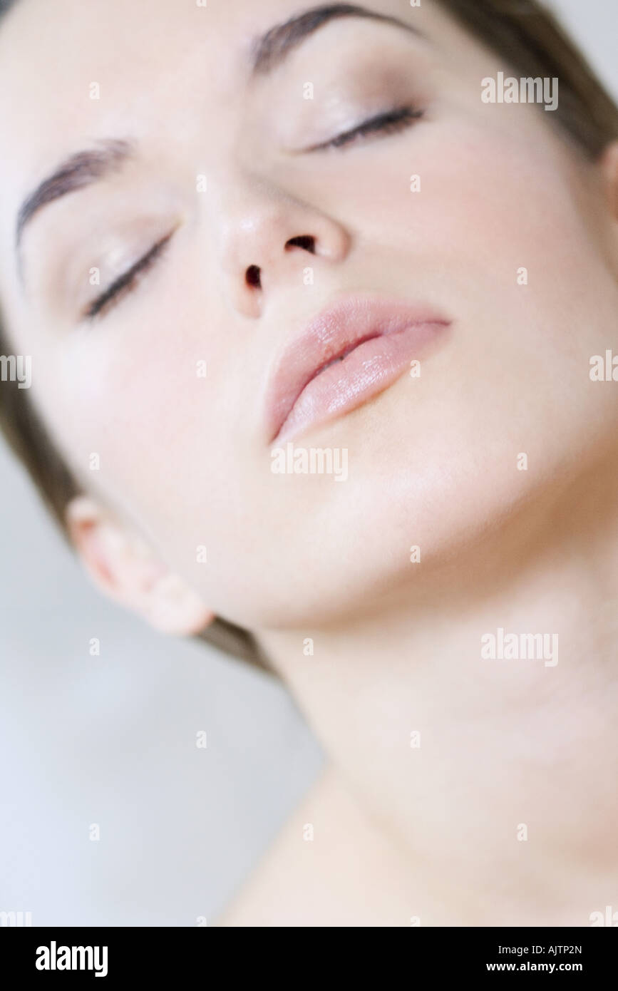 Young woman with eyes closed, head back, portrait Stock Photo Alamy