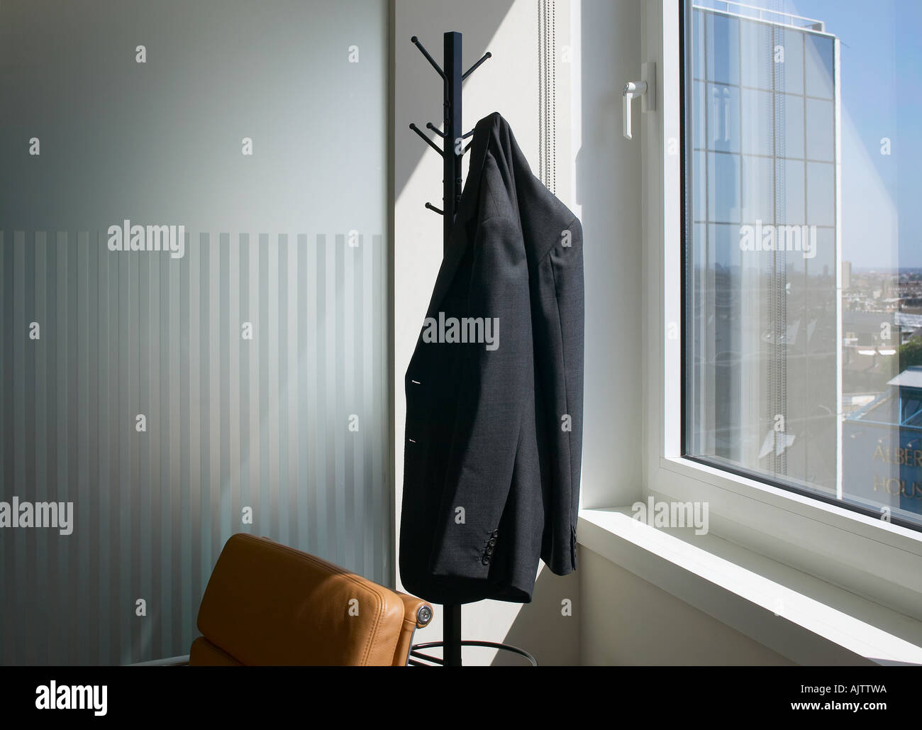 Office life and Interiors Part Two. Hatstand with suit jacket. Stock Photo