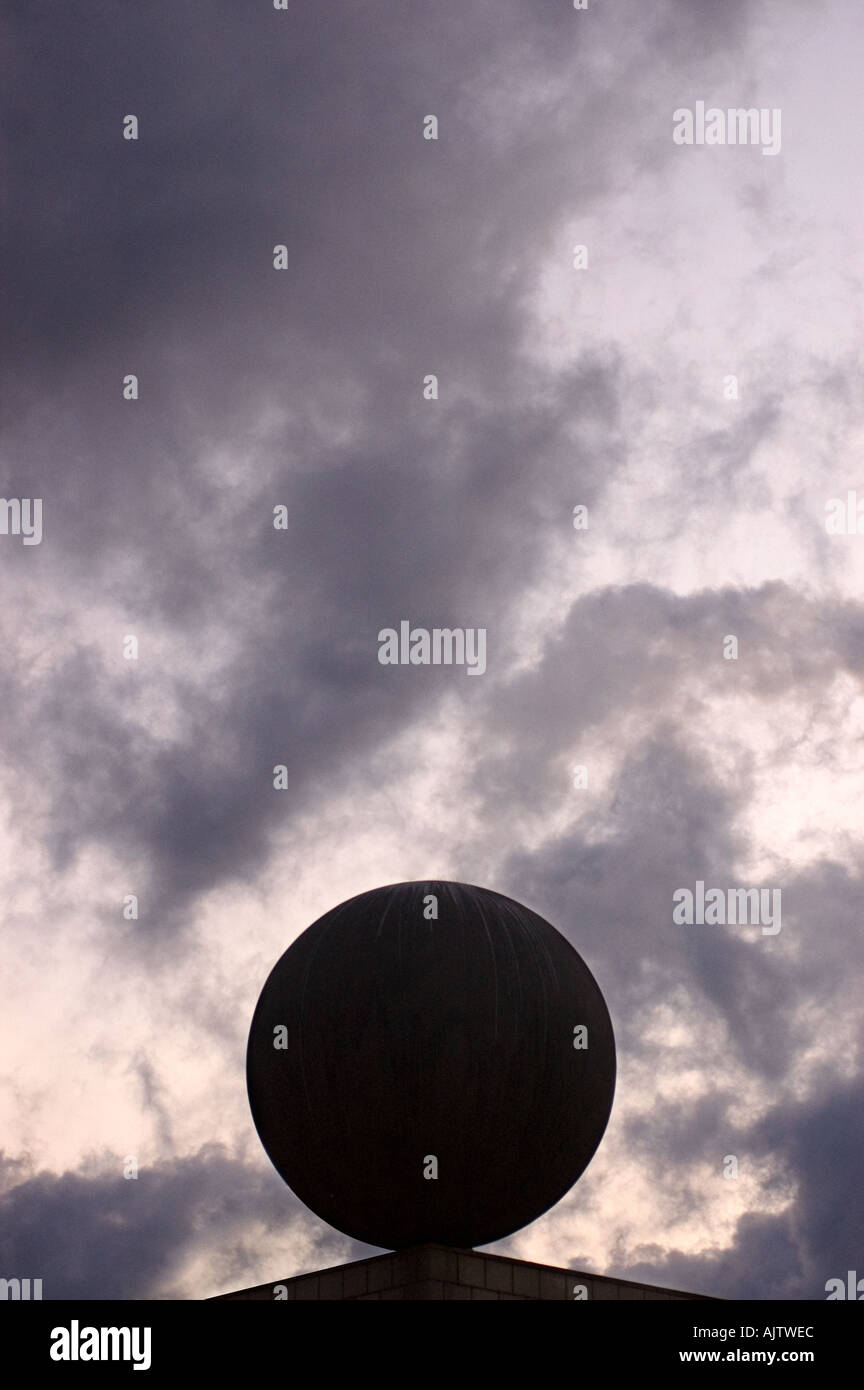 geometrical sculpture against cloudy sky barcelona spain Stock Photo