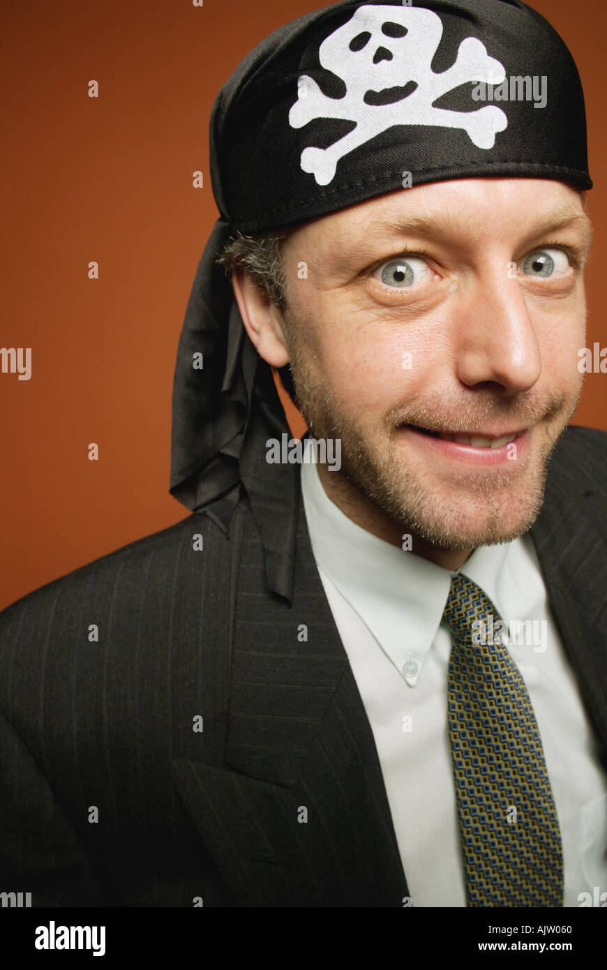 Man having fun playing a practical joke as a wacky pirate Stock Photo