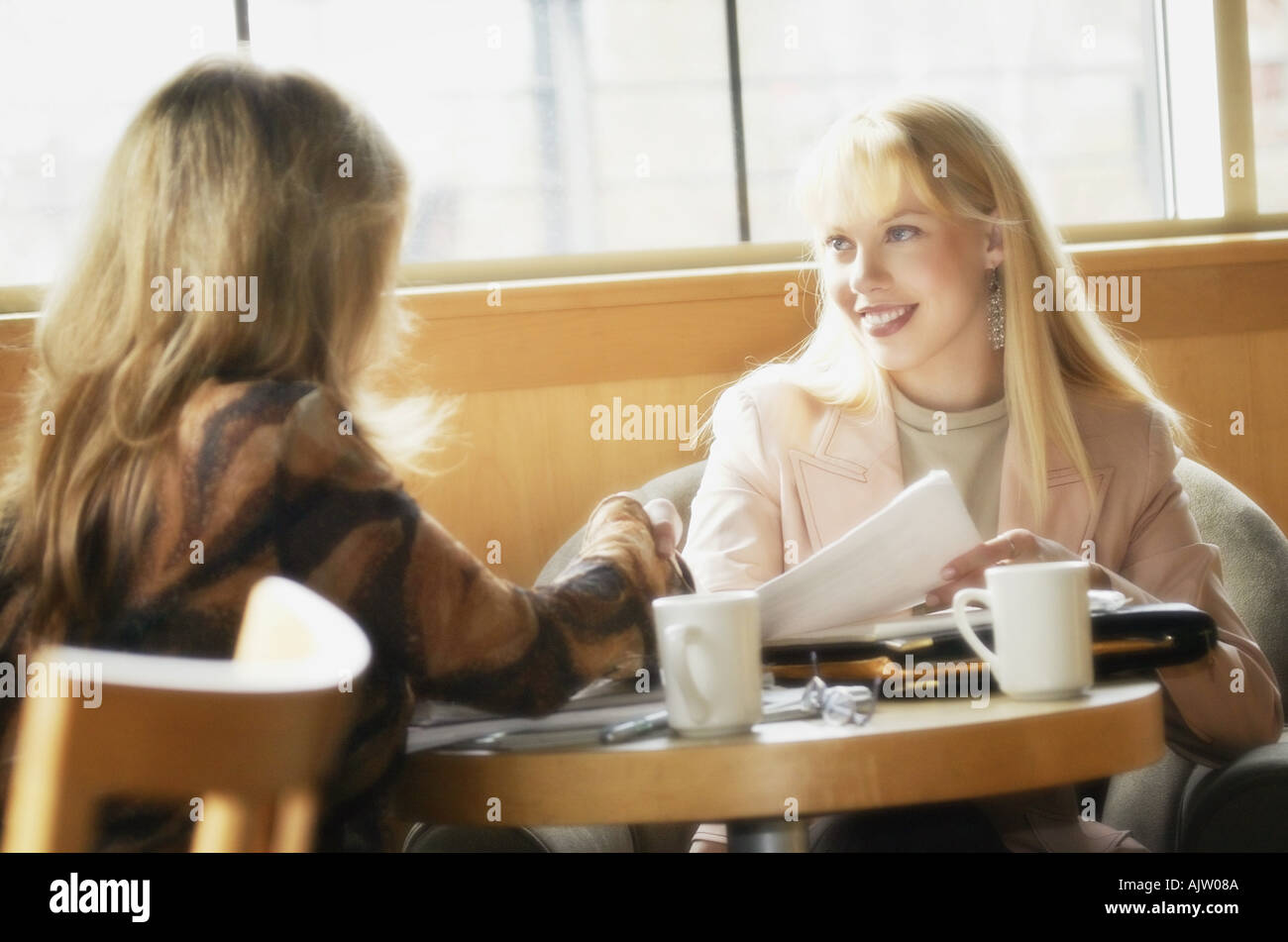 Two Women Having Coffee Stock Photo Alamy