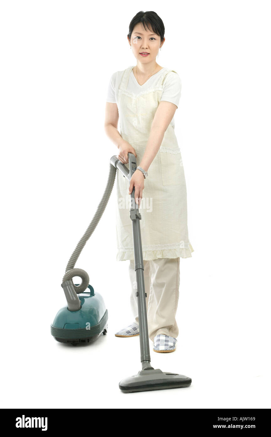 Asian lady cleaning her house Cut Out Stock Images & Pictures - Alamy