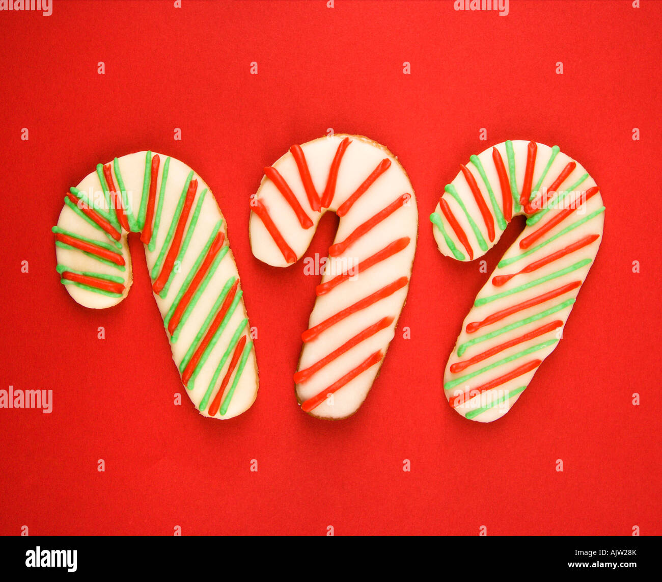 Three candy cane sugar cookies with decorative icing Stock Photo Alamy