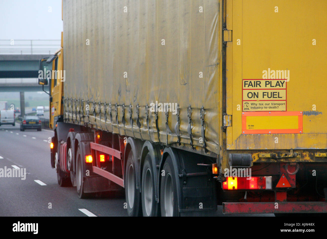 Sign on back of lorry 'fair play on fuel, why tax our transport industry to death' Stock Photo
