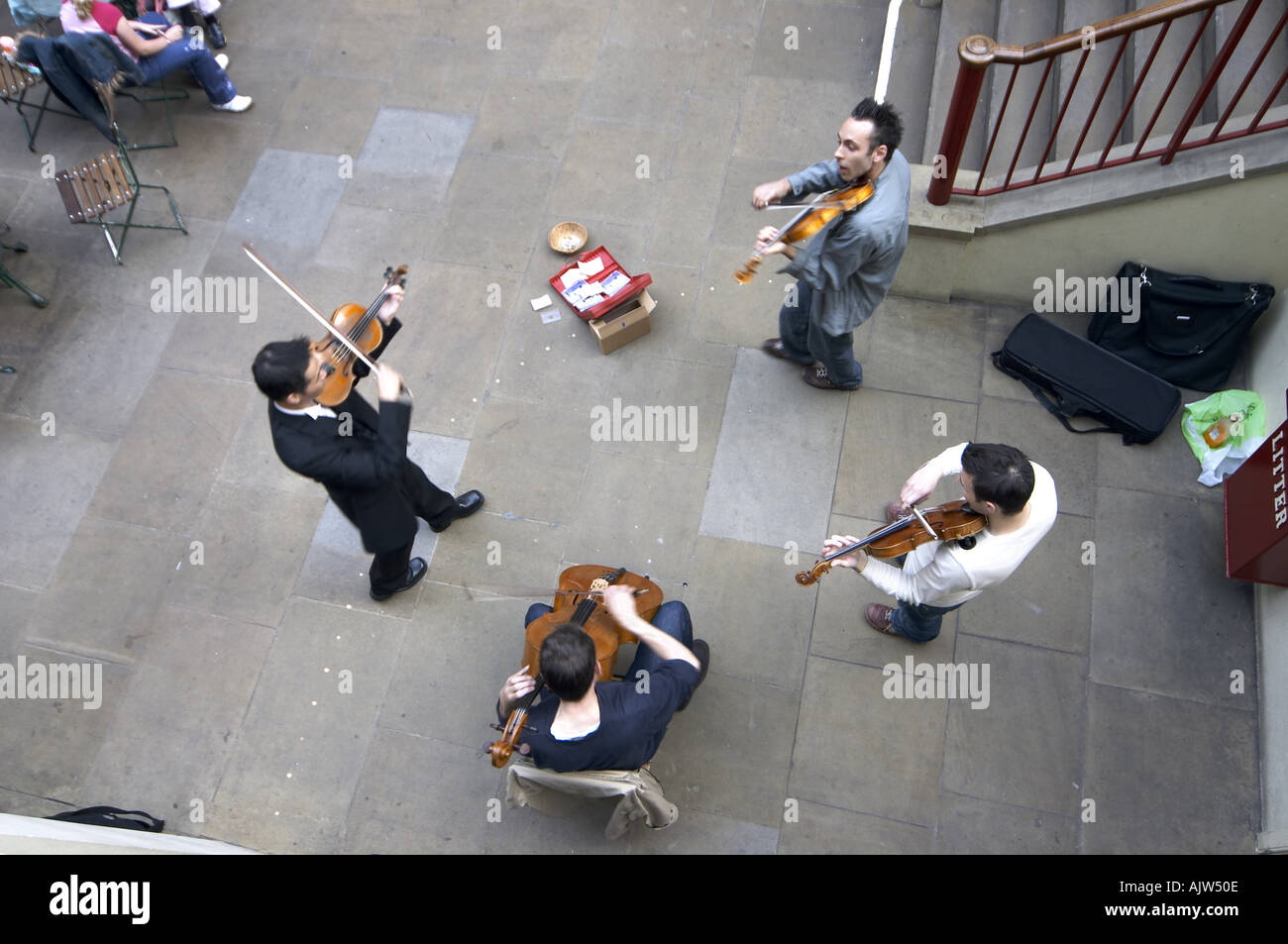 Busker musicians playing string instruments Covent Garden Market London ...