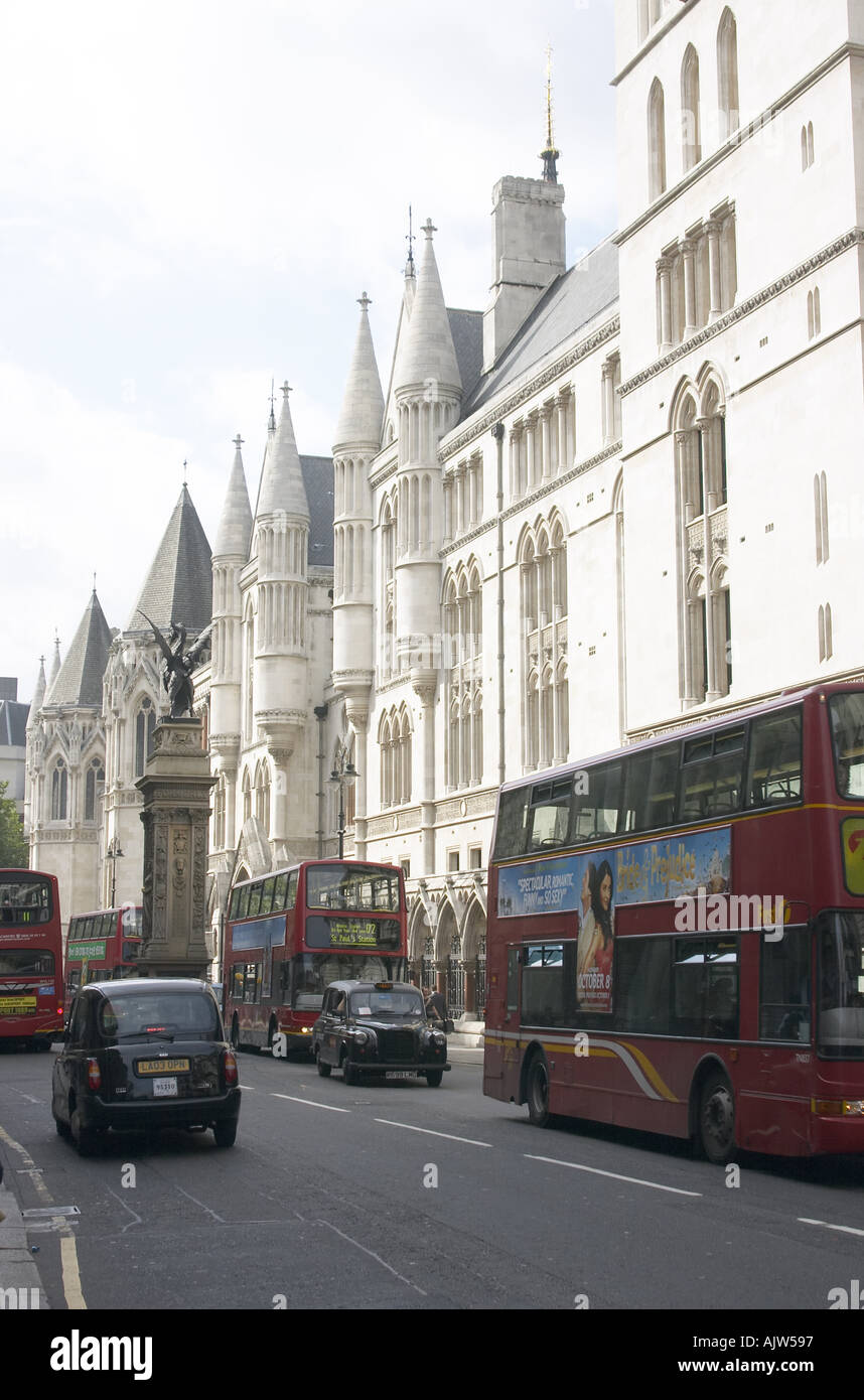 The Royal Courts of Justice with London busses and taxis Strand London WC2 Stock Photo