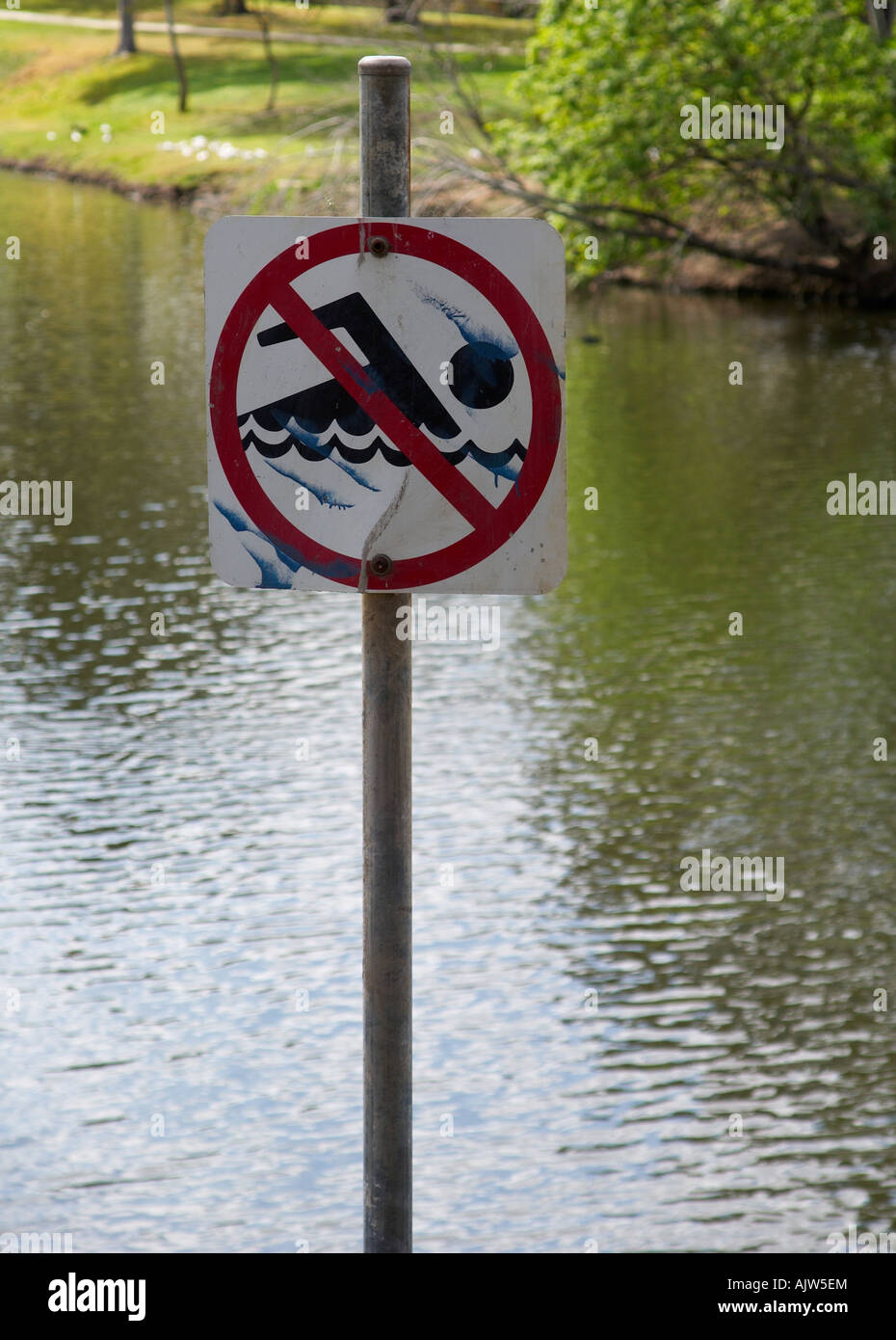 No swimming sign at the lake. Stock Photo