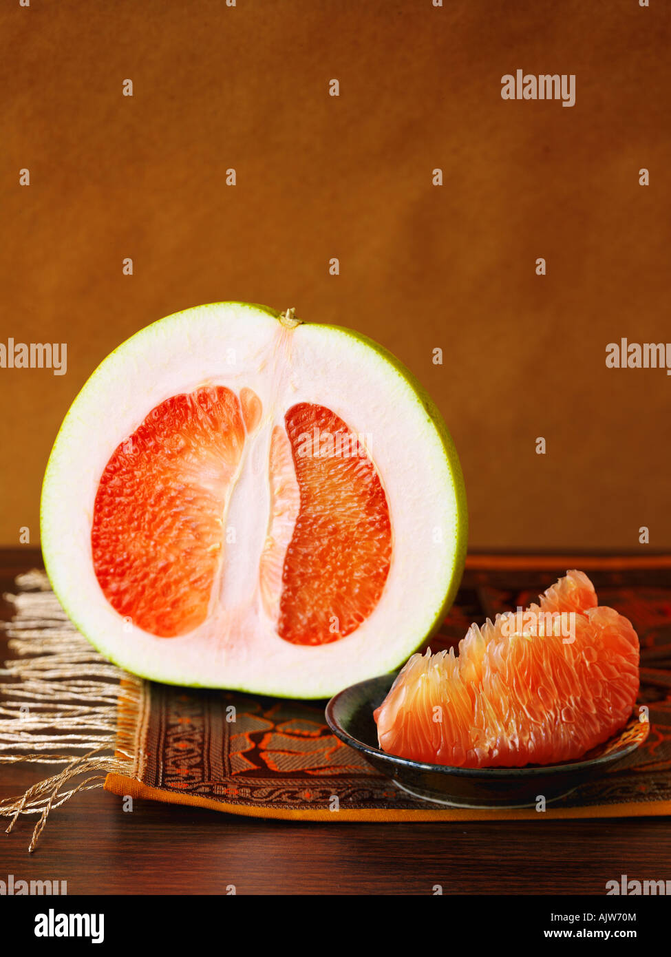 Red Pomelo Showing Sections Stock Photo