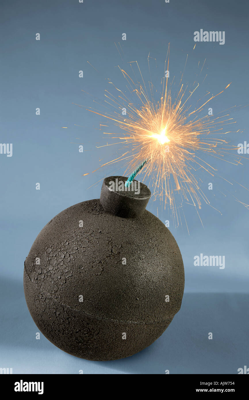 An old fashioned style round bomb with a lit fuse about to explode Stock Photo