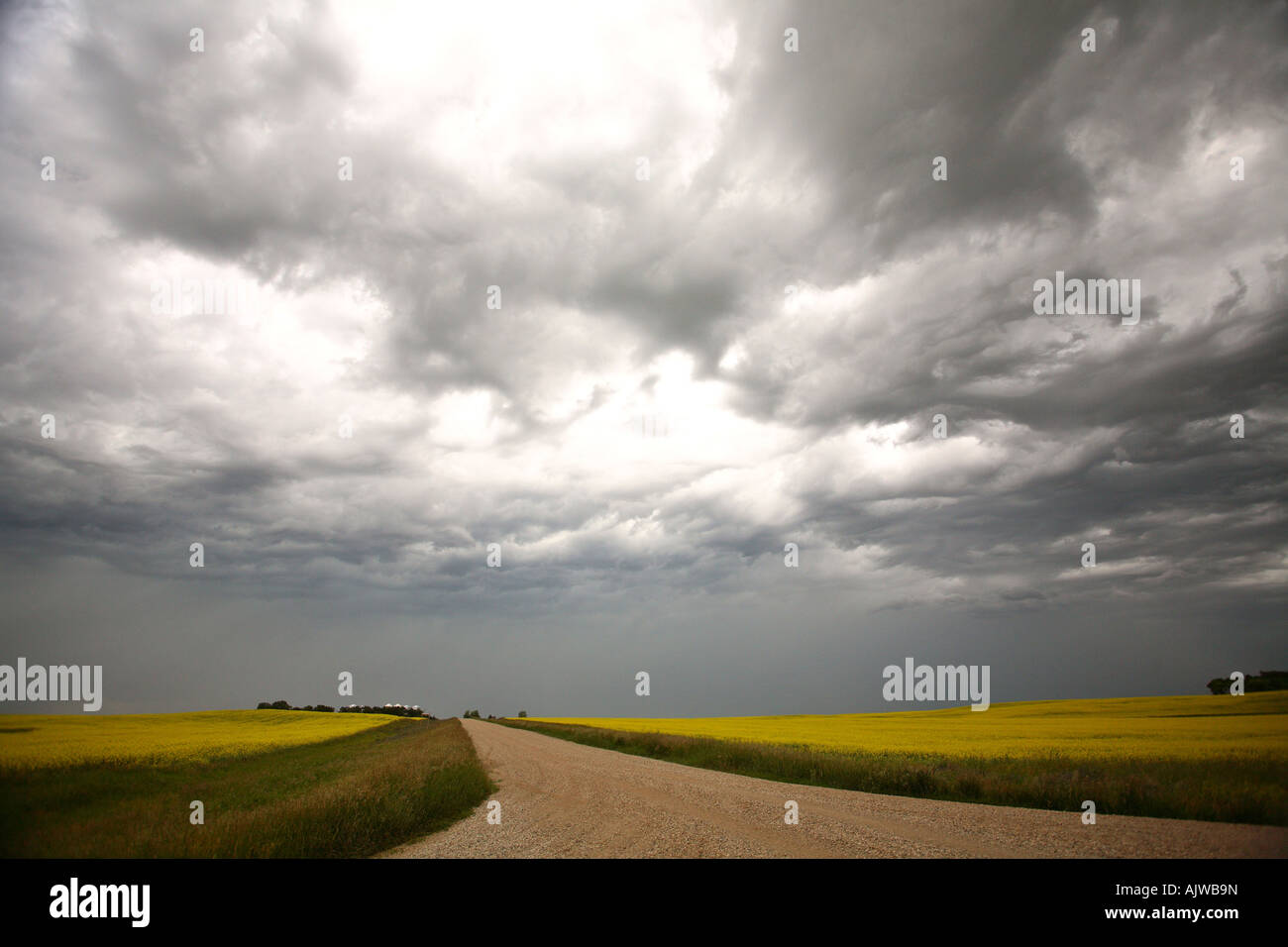 Rain and storm clouds along a country road Stock Photo - Alamy