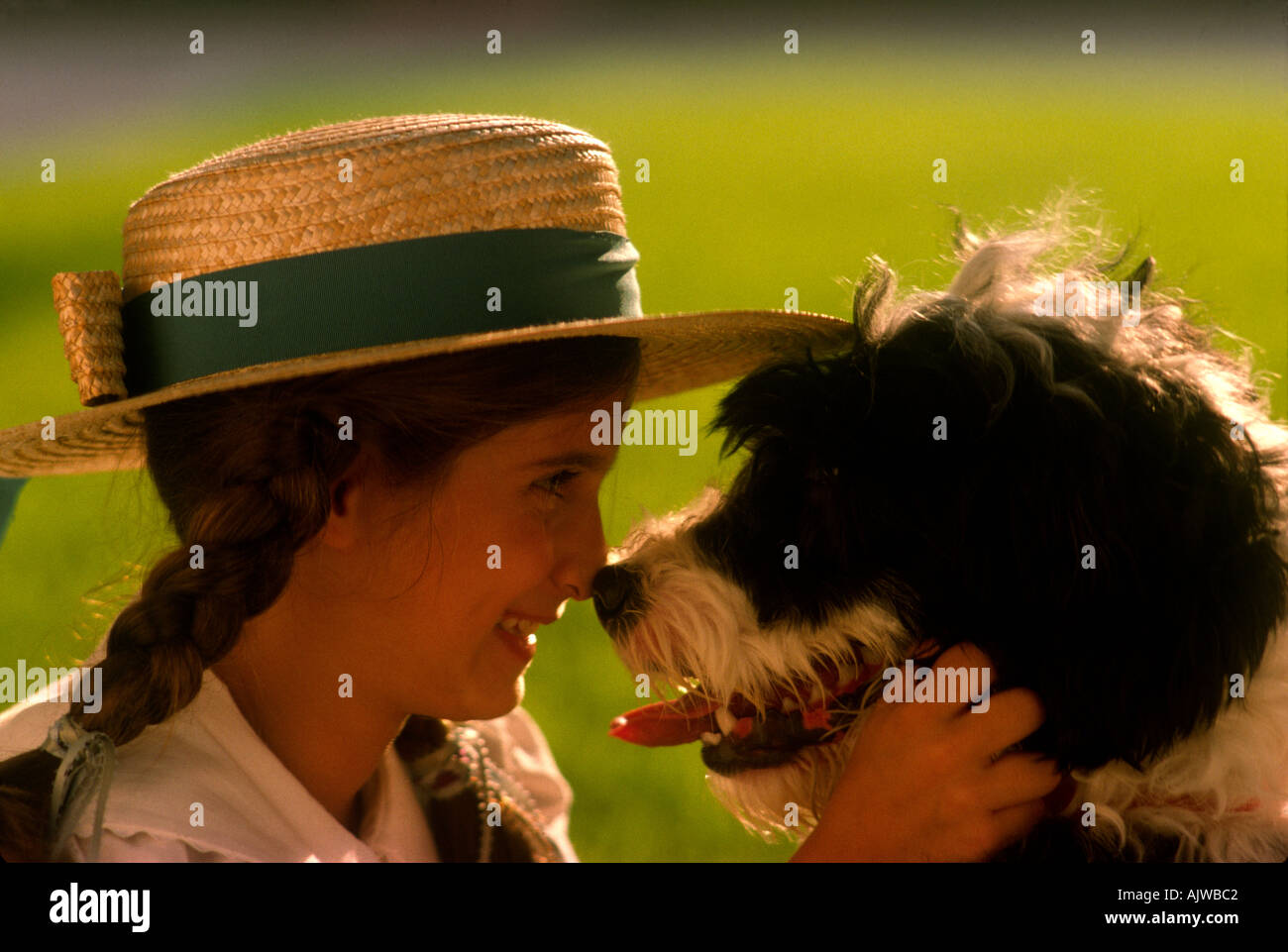 A young girl plays with her dog in a park in Houston Texas Stock Photo ...