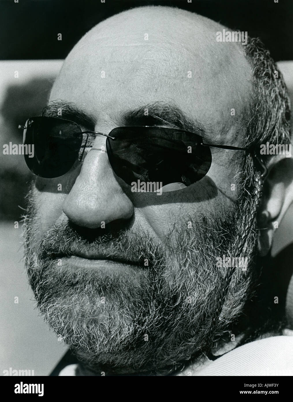 Black and white portrait of bearded man (40s) wearing sunglasses. Stock Photo