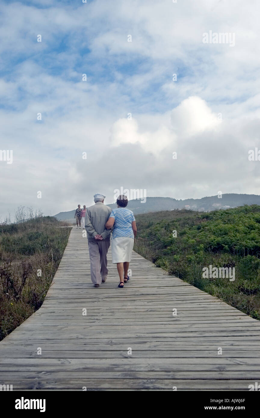 Senior man and woman walking on path, galicia, spain Stock Photo