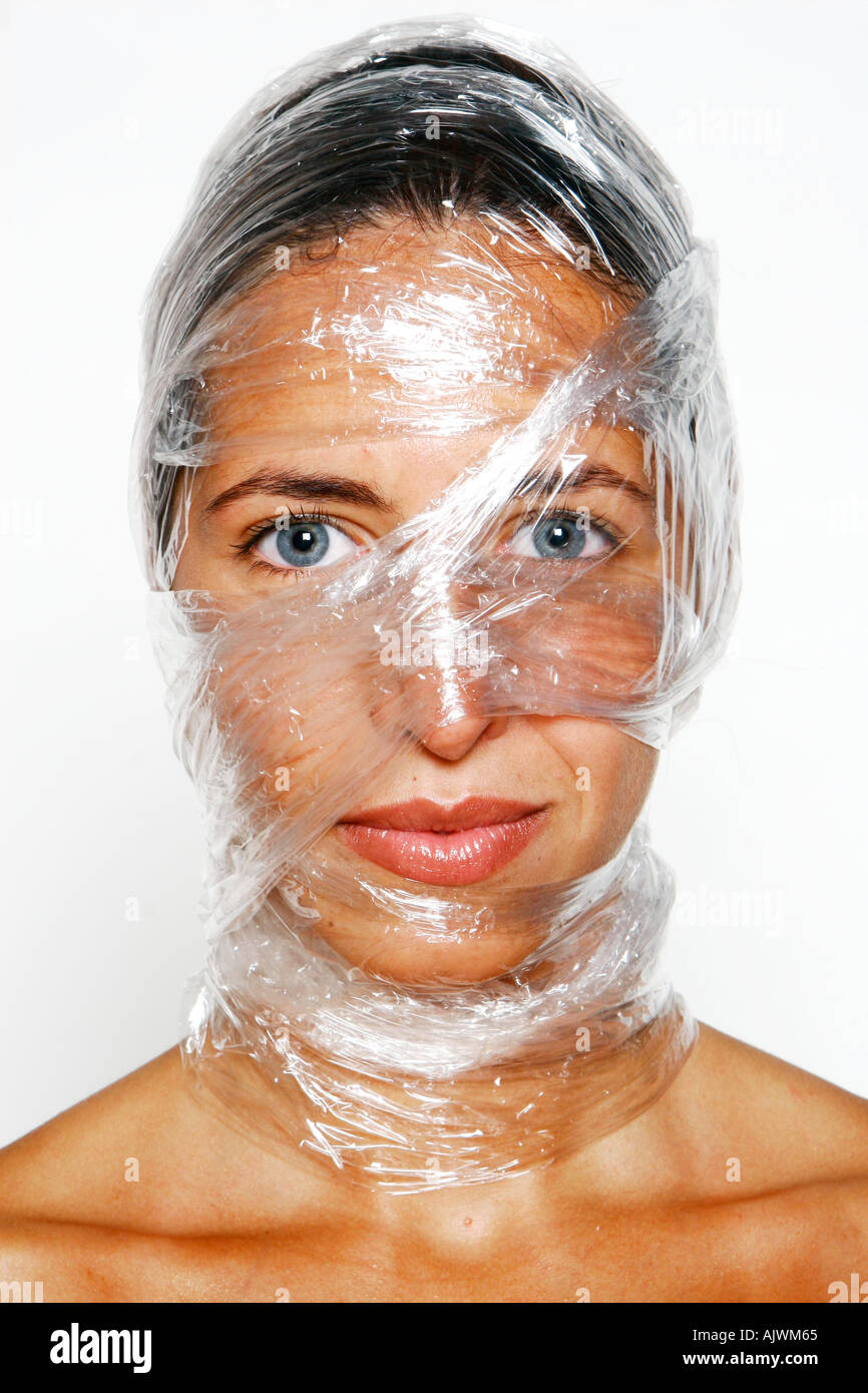 woman with cling film wrapped around her head and face Stock Photo Alamy