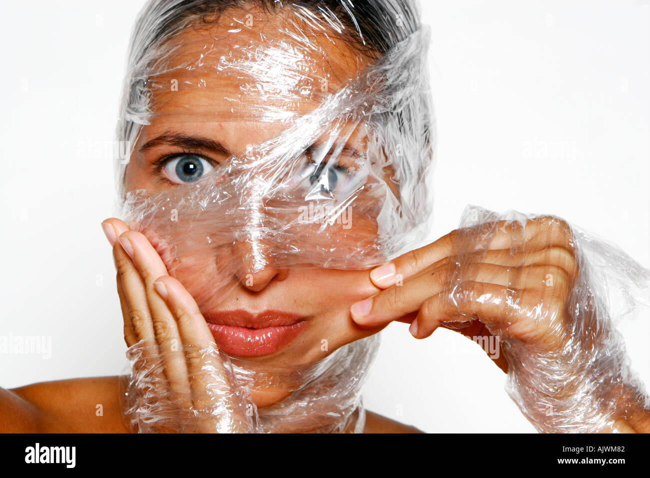 woman with cling film wrapped around her head and face Stock Photo Alamy