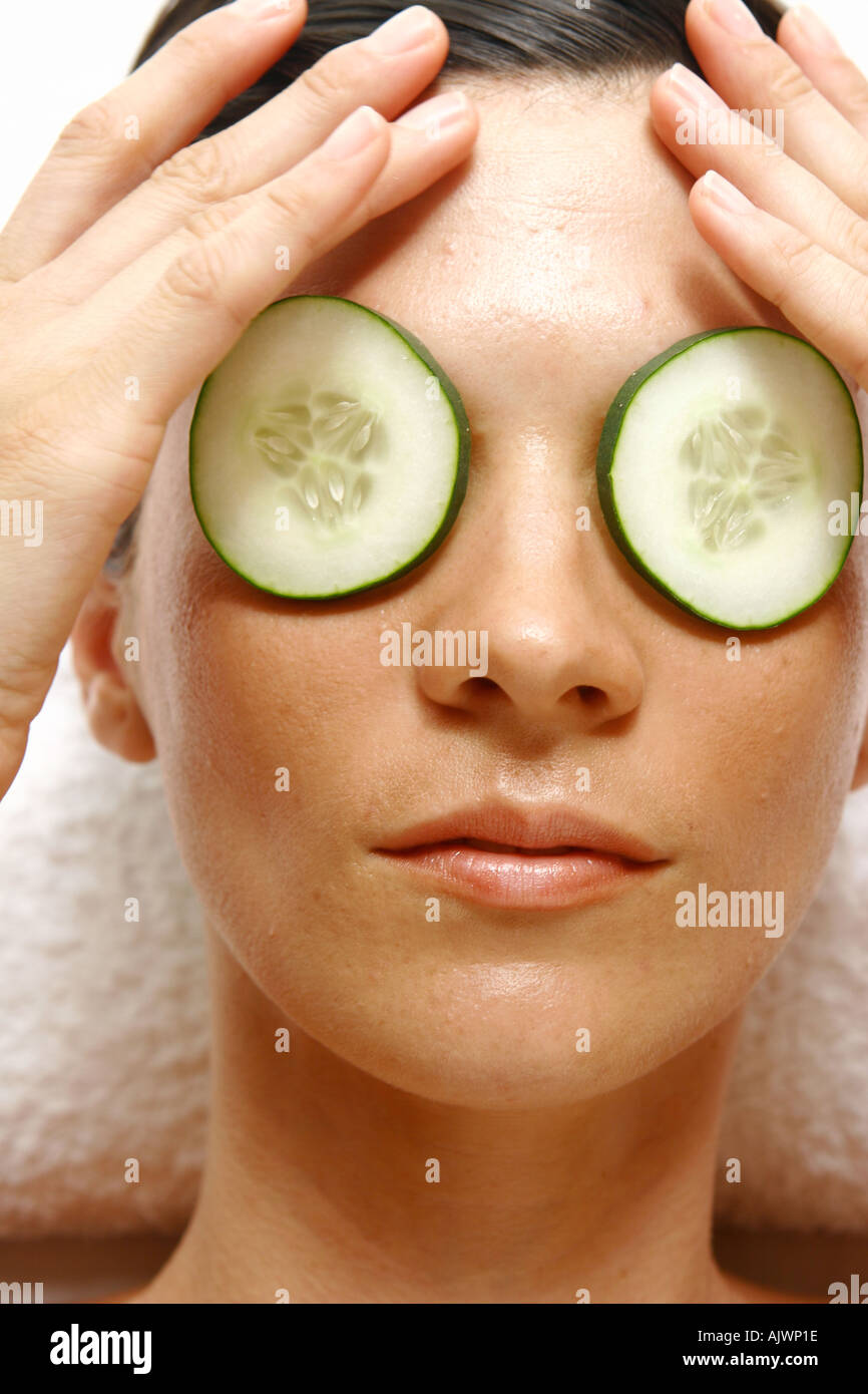 beauty shot of woman with cucumbers over her eyes Stock Photo Alamy