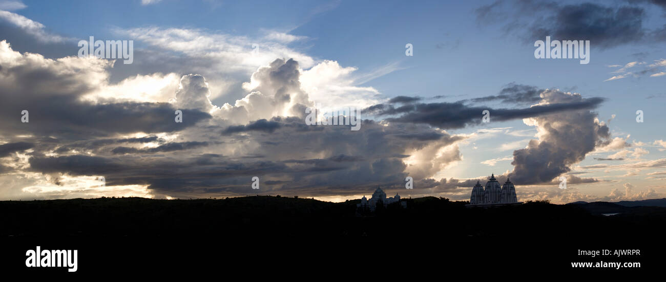 Sunset storm clouds over Indian ashram buildings panoramic. Puttaparthi, Andhra Pradesh, India Stock Photo