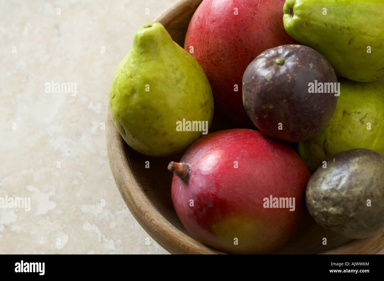 Mango Guava and Passionfruit in wooden bowl Stock Photo Alamy