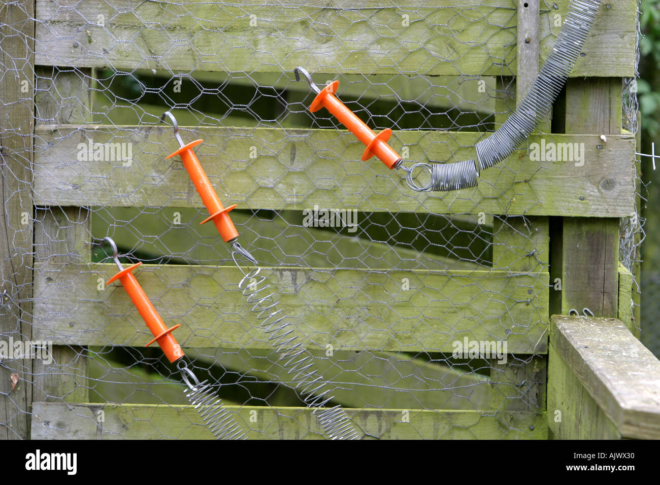 Unusual springs on gate hinges Stock Photo Alamy