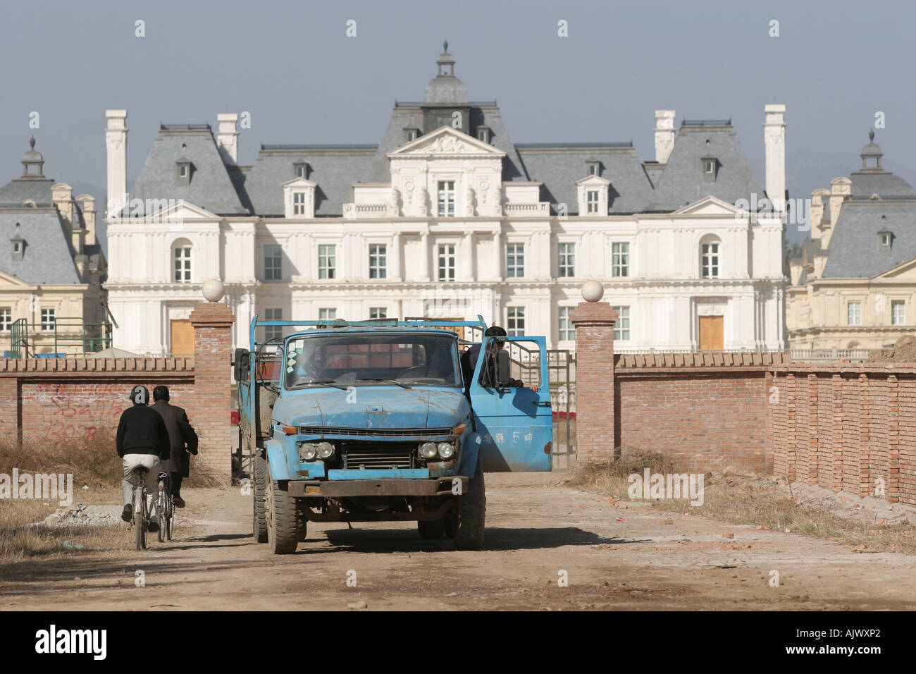 Maintenance staff arrive, and depart, from the Beijing Lafette Chateau, now a hotel, outside Beijing. Stock Photo