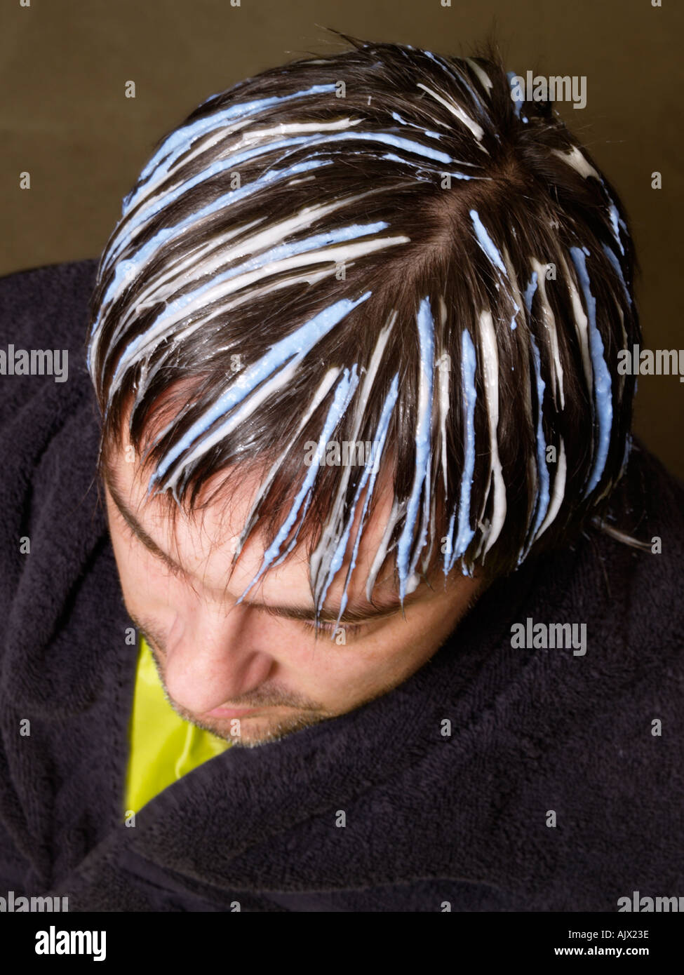 Man having his hair dyed with two different colours of highlights Stock  Photo - Alamy