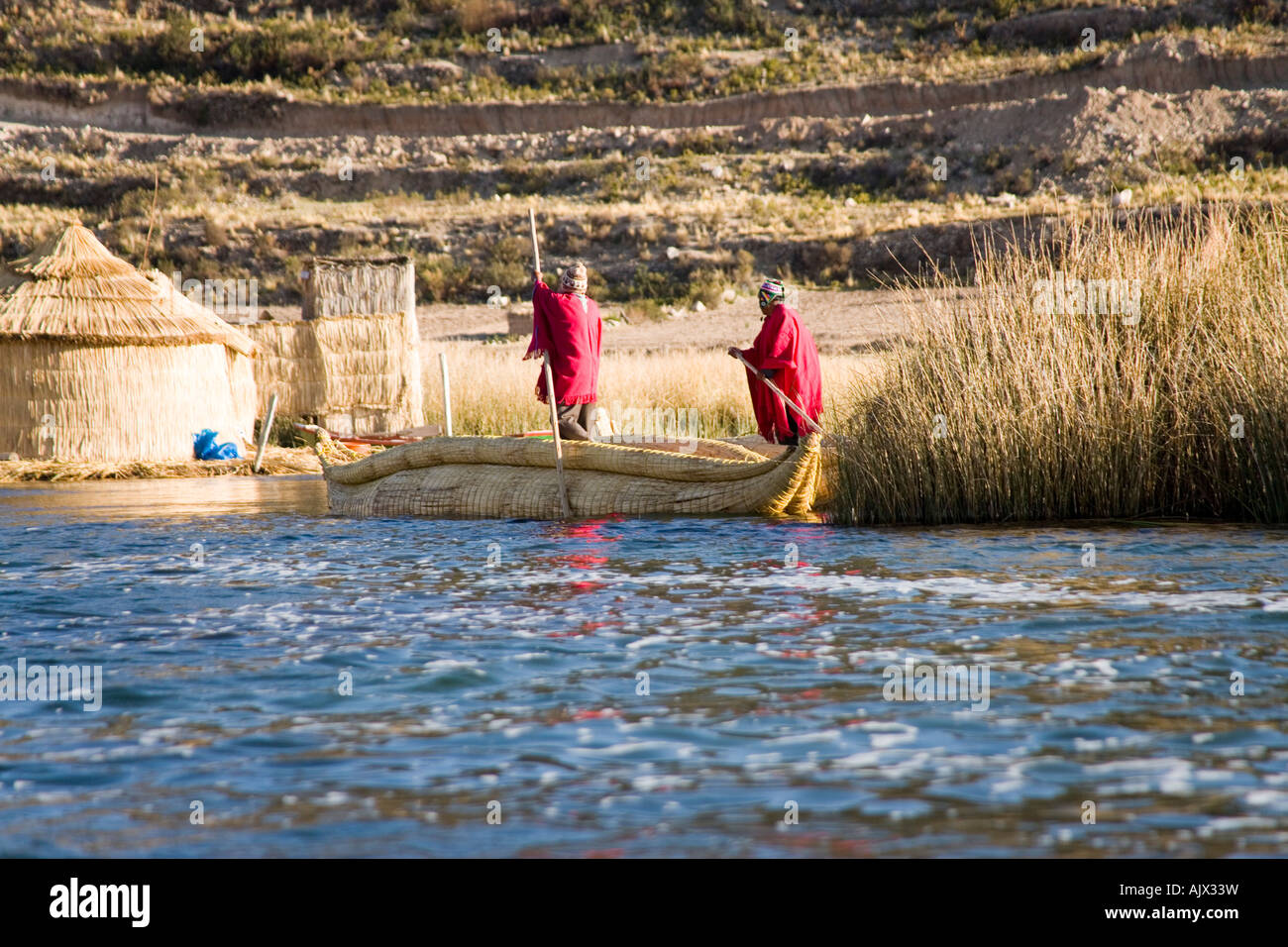 Uros Iruitos Indians paddling a reed canoe by the Phuwa island a