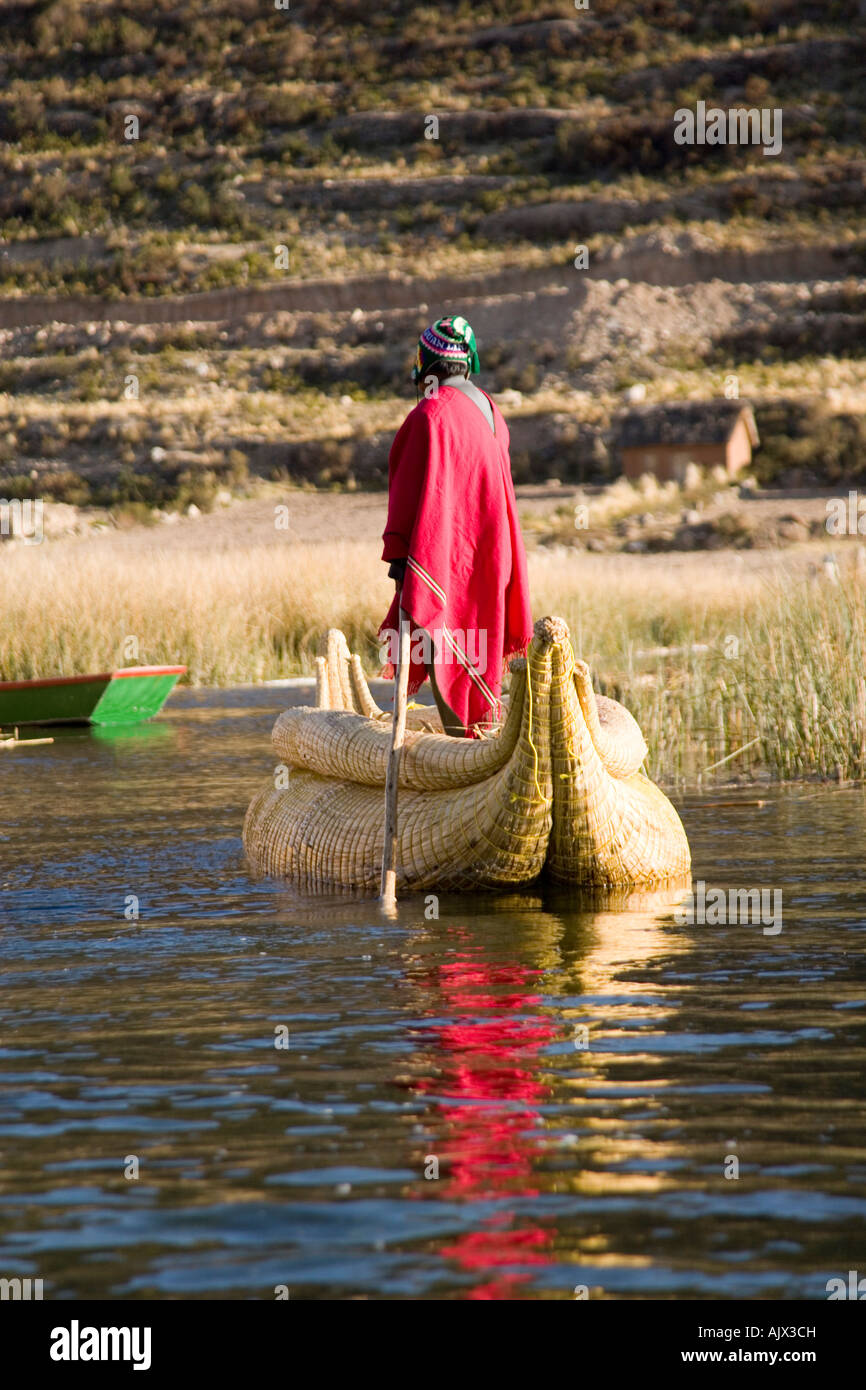 Uros Iruitos Indian paddling a reed canoe by the Phuwa island a ...