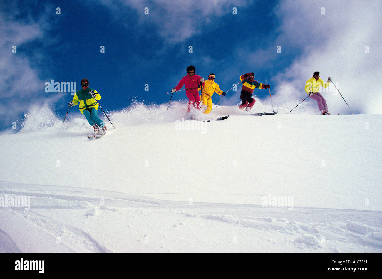 Group of young people downhill skiing Stock Photo Alamy
