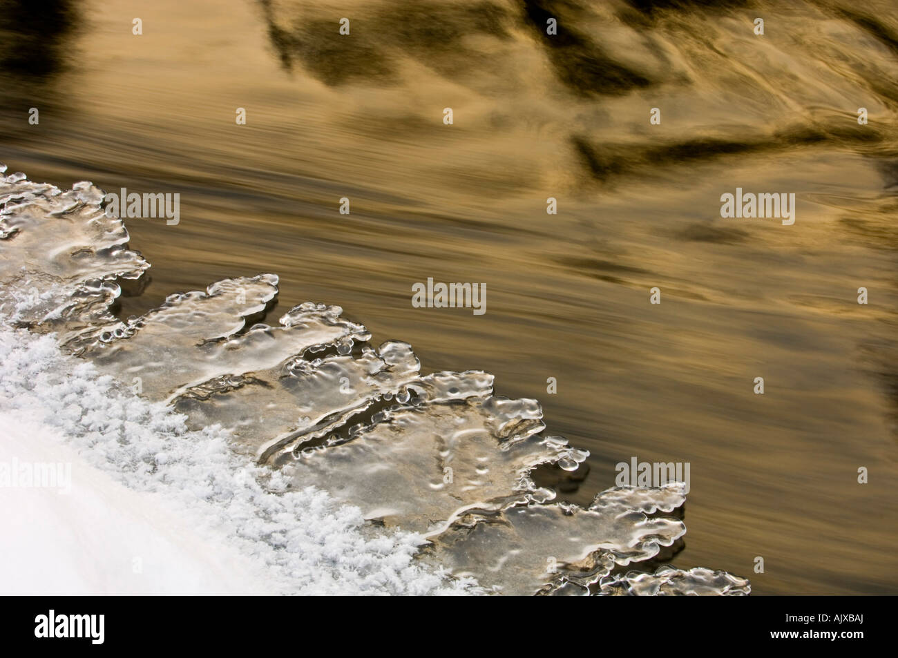 Shoreline ice formations and running water along edge of Junction Creek