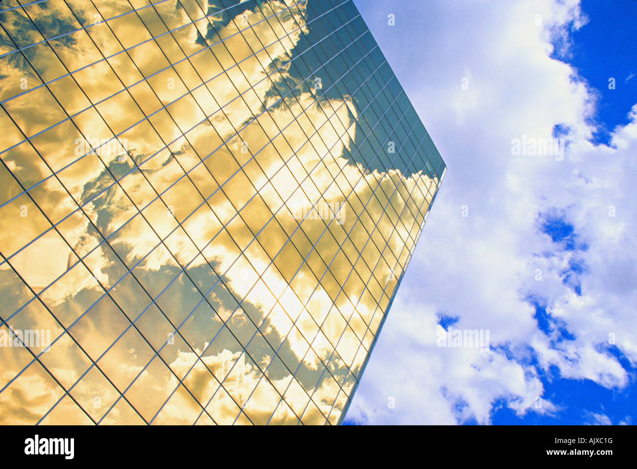 Office building windows reflecting clouds Stock Photo - Alamy