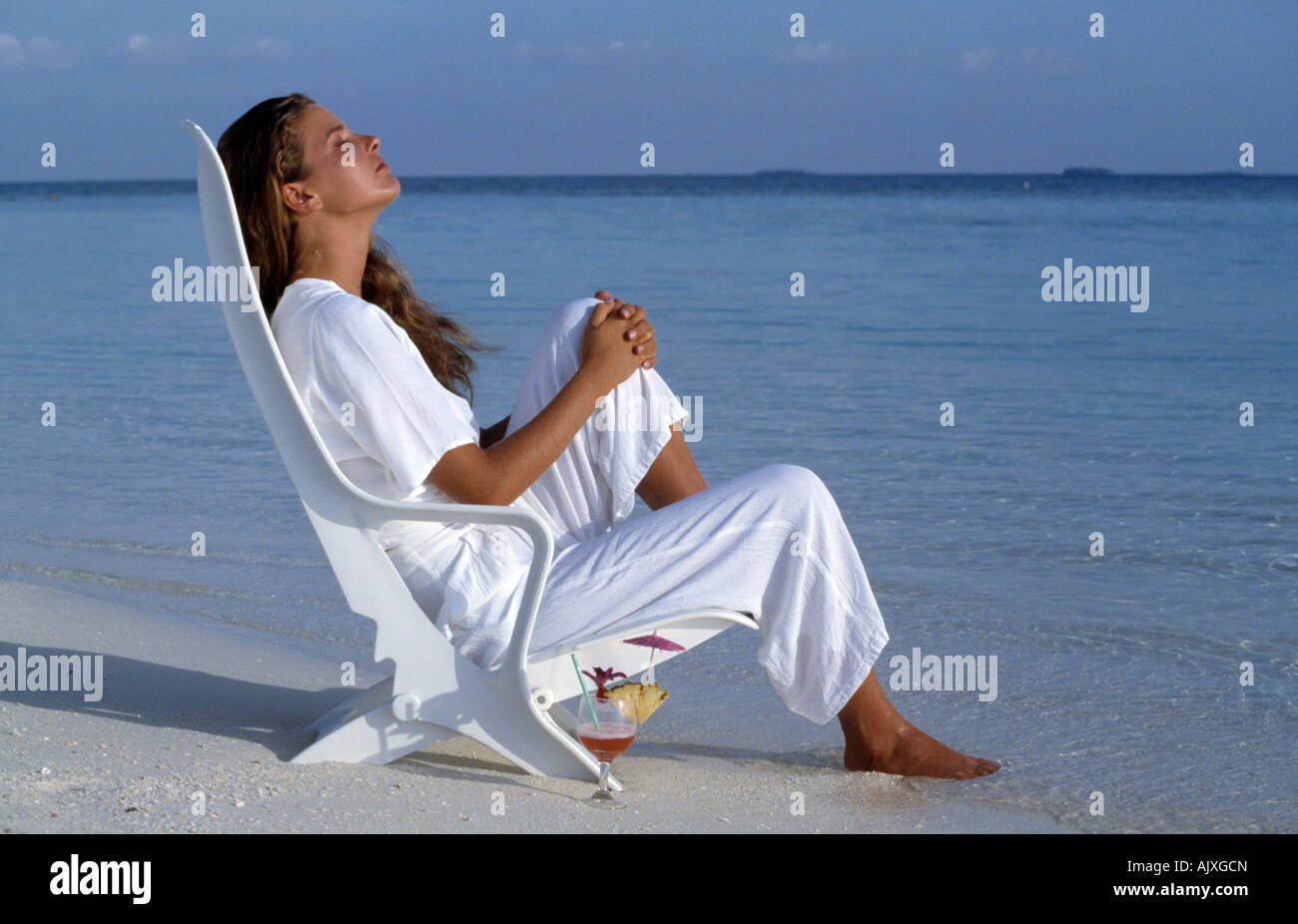 Woman sitting chair full length hi-res stock photography and images - Alamy