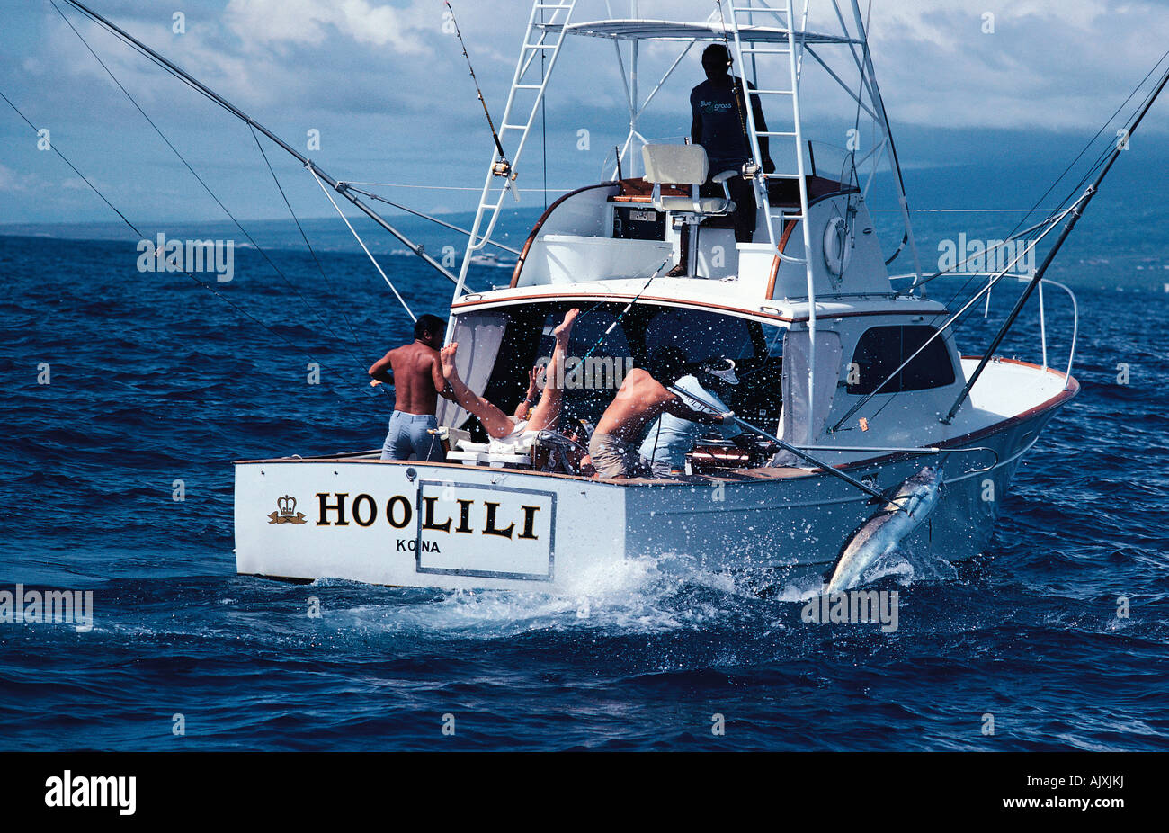 Hawaii. Kona. Game fishing boat. Men catching a Marlin. Stock Photo