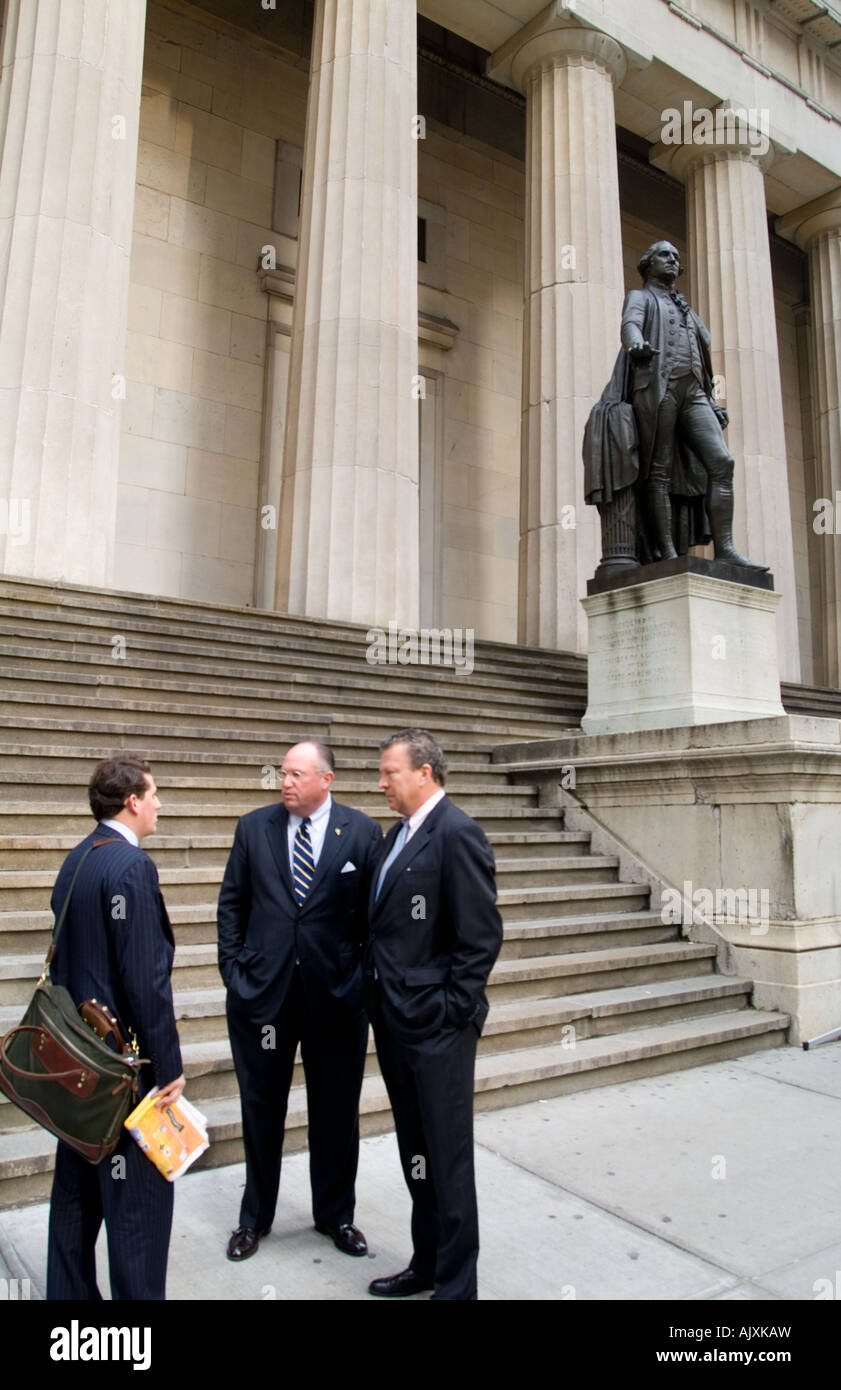 Businessmen in front of famous George Washington statue at Federal Hall ...