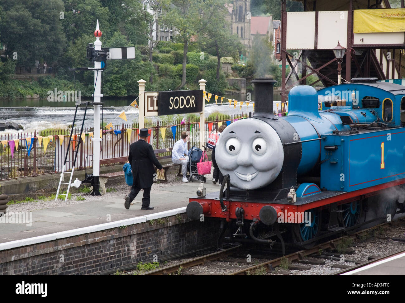 Steam train Thomas the Tank Engine in Llangollen Steam Railway station with Fat Controller on platform Denbighshire North Wales Stock Photo