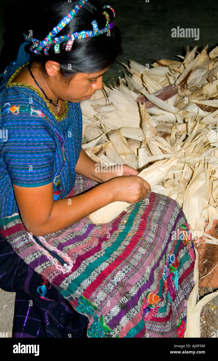 Woman separating corn in Lake Atitlan village of San Antonio Palopo Guatemala in Central America Stock Photo