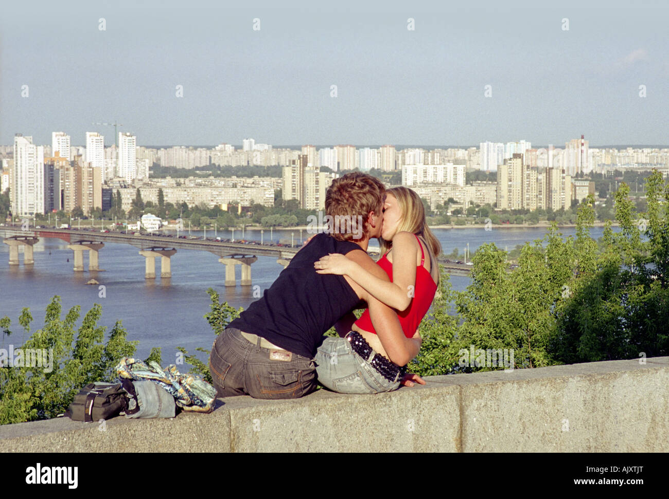 Young kissing on Dnepr hill, Kiev, Ukraine Stock Photo