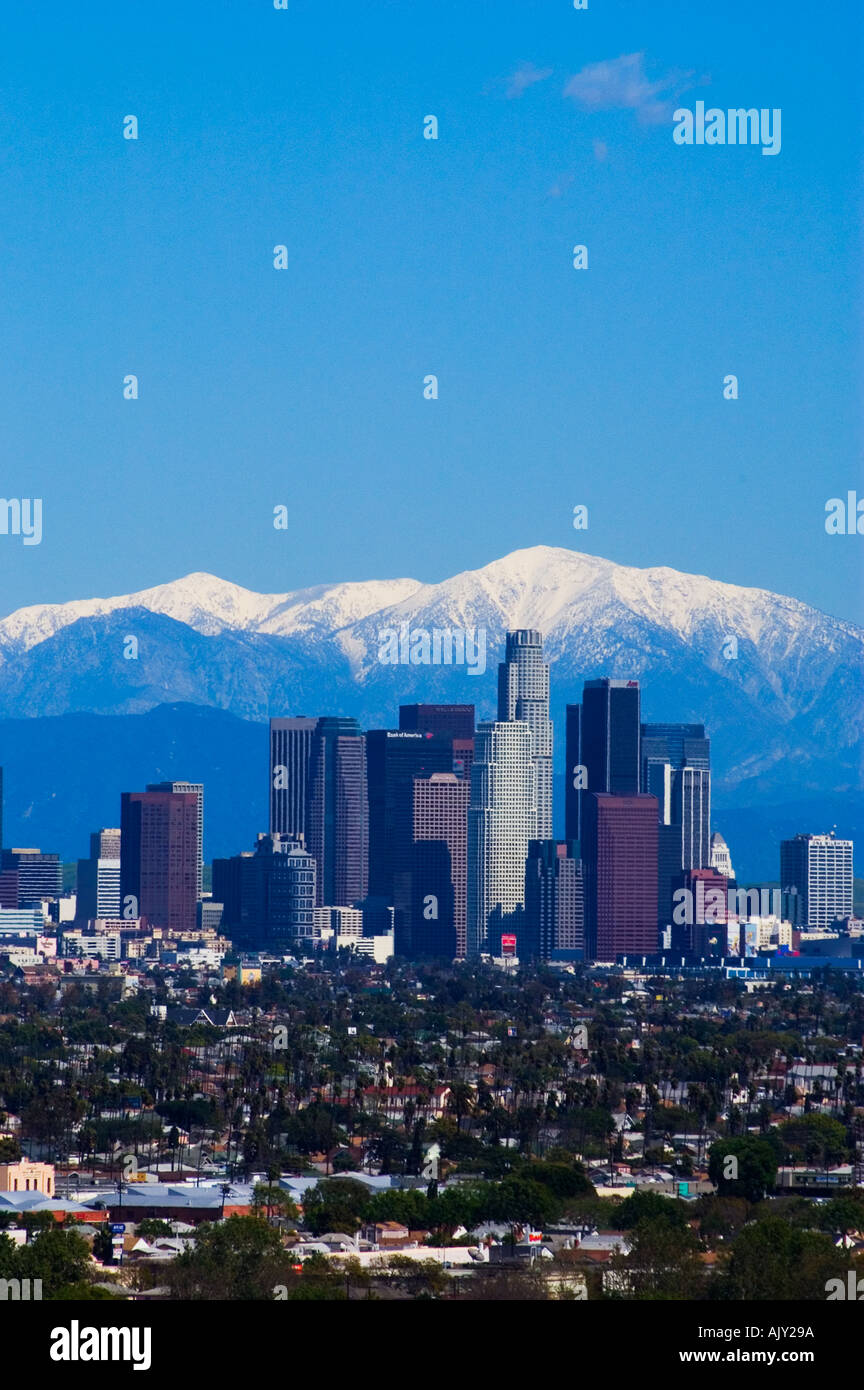 Snow covered San Gabriel Mountains behind downtown Los Angeles skyline