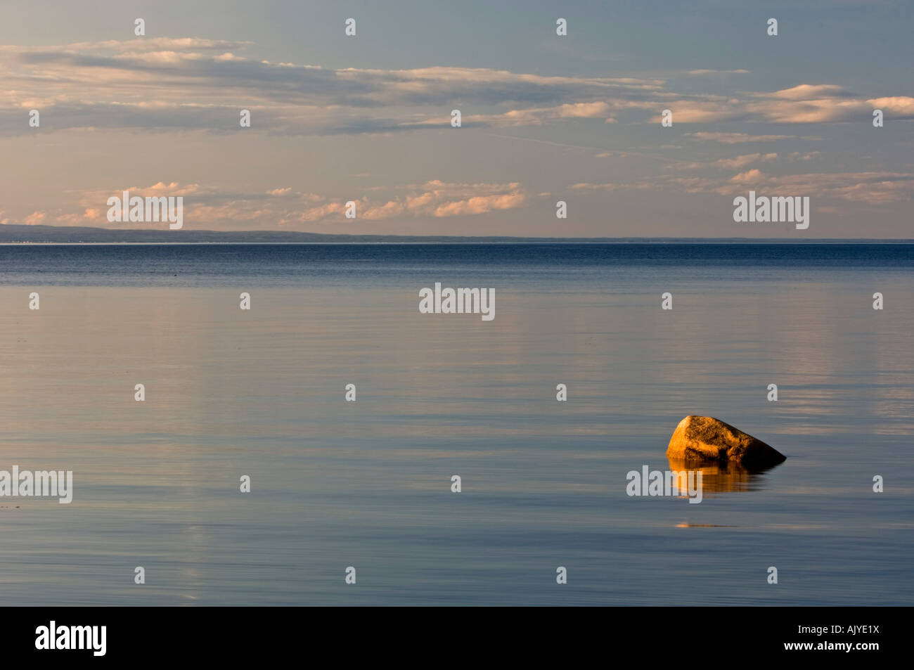 Boulder in calm Bay of Chaleur, Pokeshaw Municipal Park, Pokeshaw, NB New Brunswick, Canada