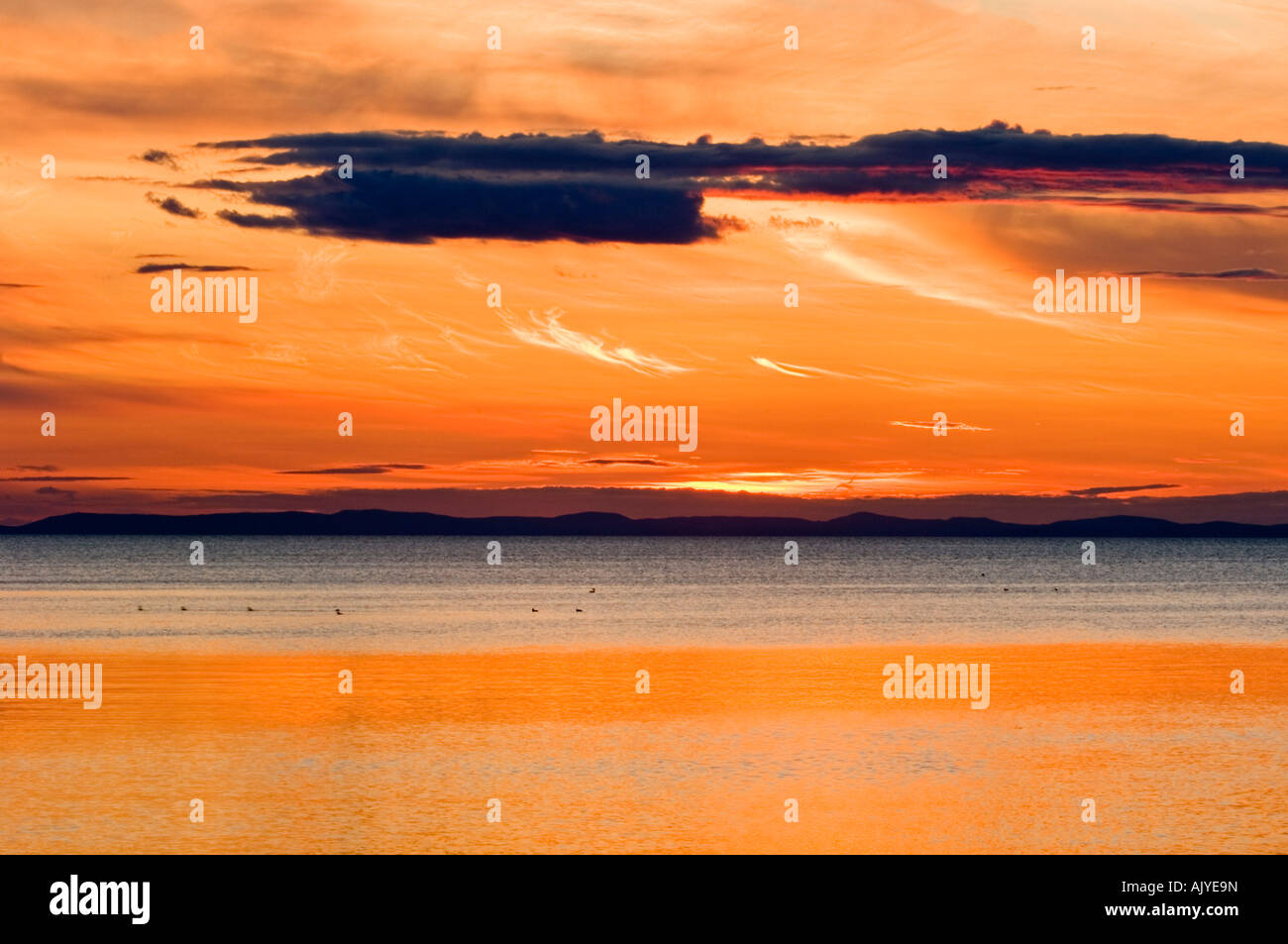 Setting sun over Bay of Chaleur, Pokeshaw Municipal Park, Pokeshaw, NB New Brunswick, Canada