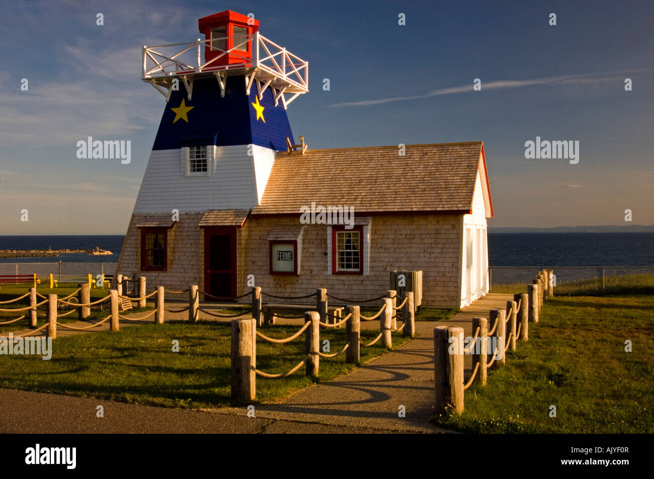 Lighthouse with Acadian flag decoration, Grand Anse, NB New Brunswick