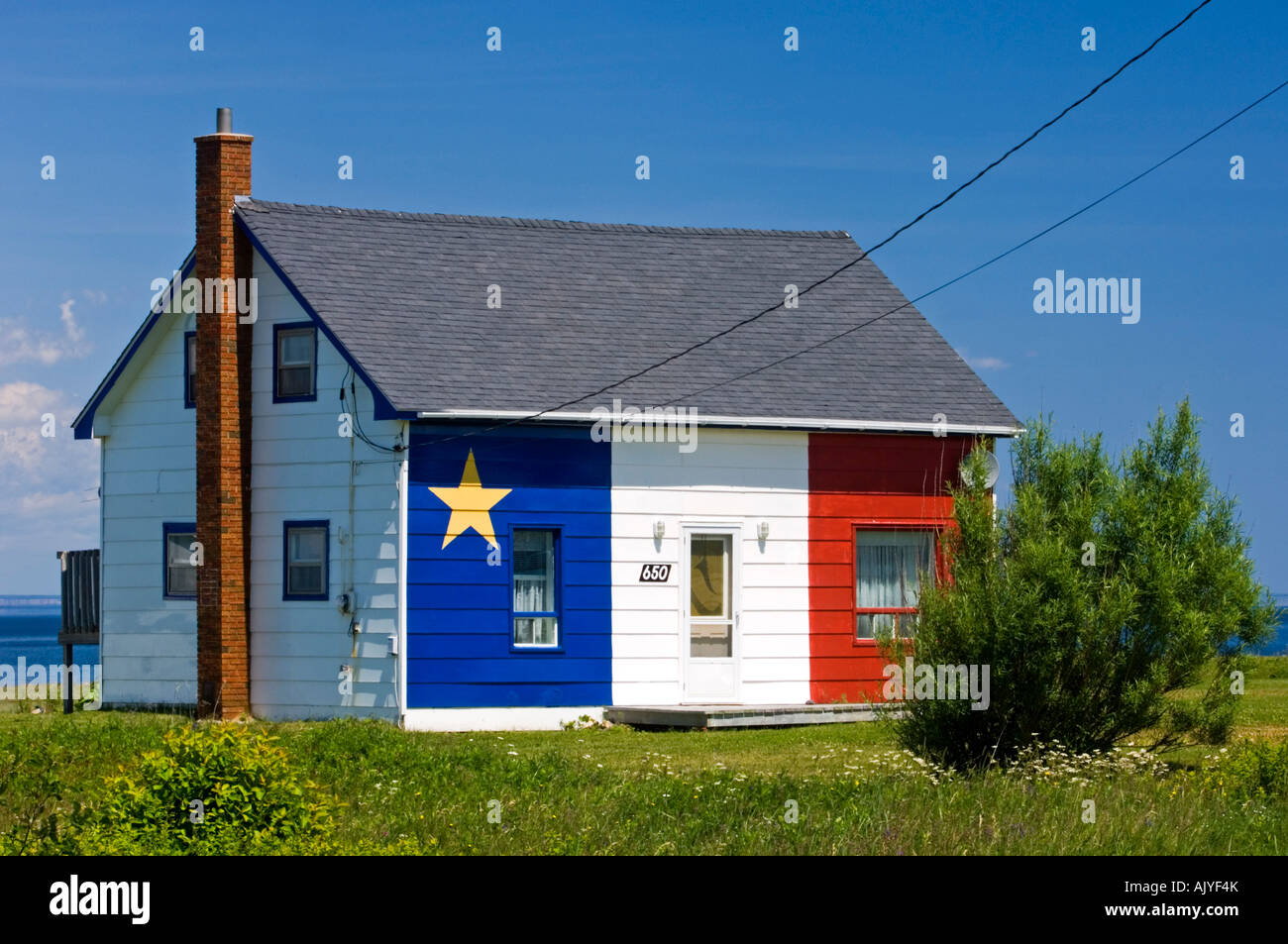 House painted with Acadian flag, Grand Anse, NB New Brunswick, Canada Stock Photo Alamy