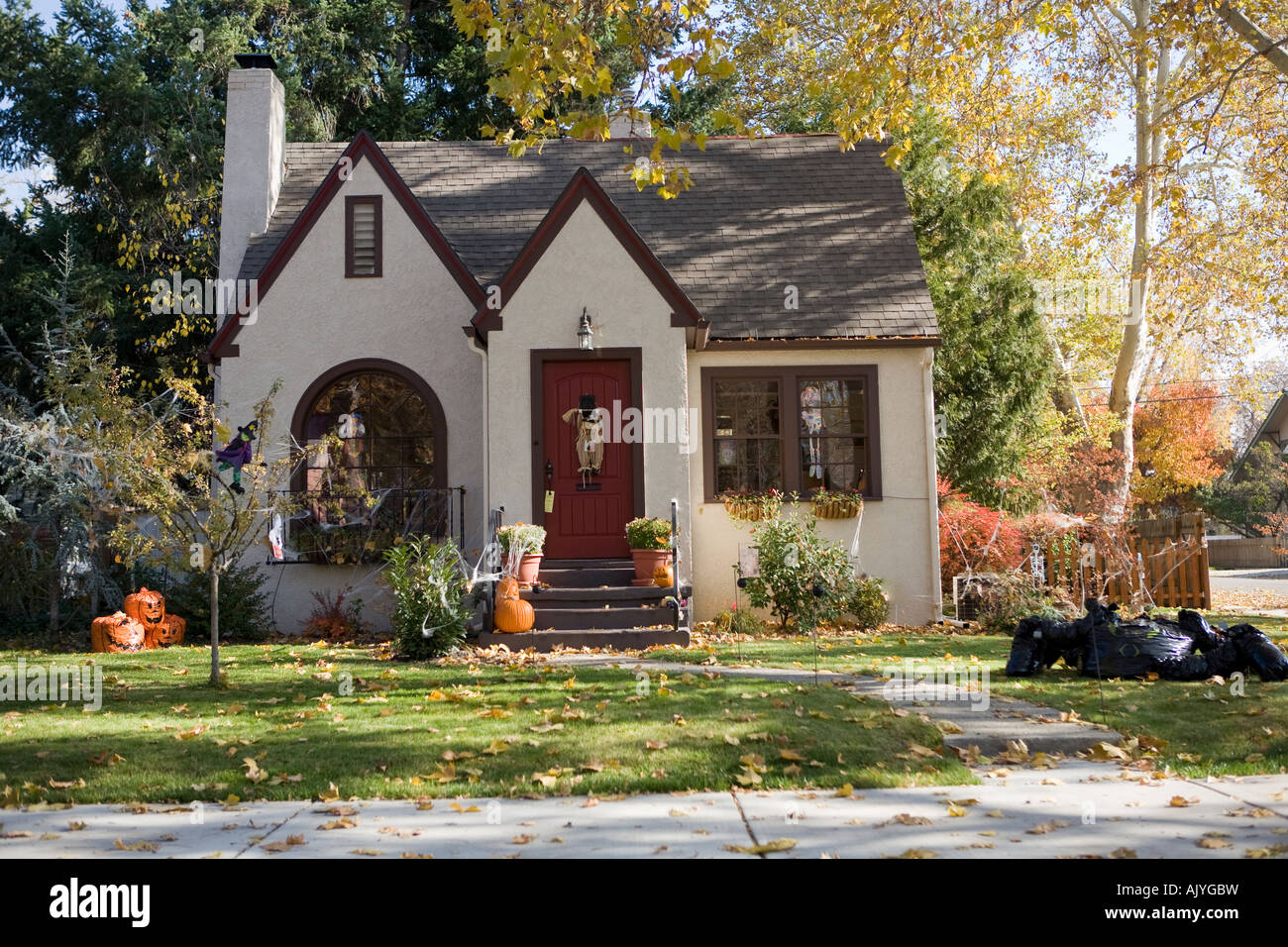 Cute cream colored vintage house in the fall Stock Photo - Alamy