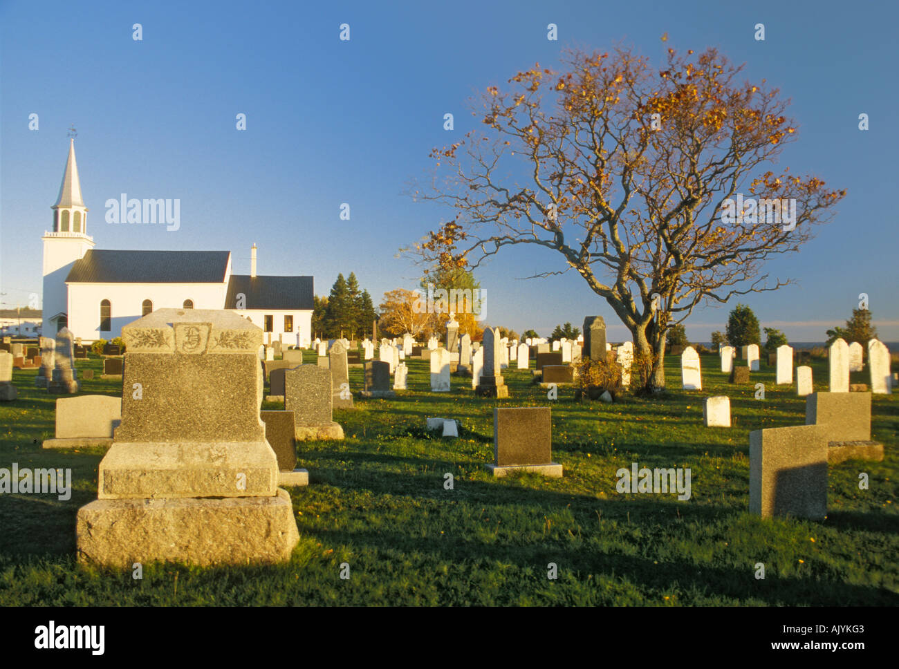 The graveyard and wooden church at New Richmond in Gaspesie Quebec Stock Photo