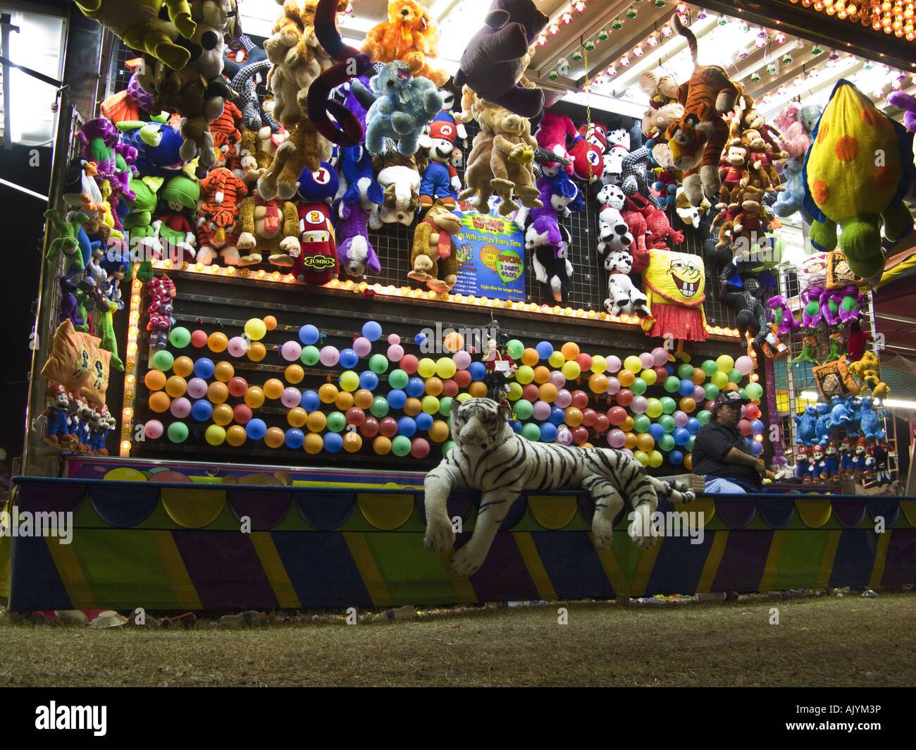 Carnival booth with no customers to throw darts at balloons Stock Photo