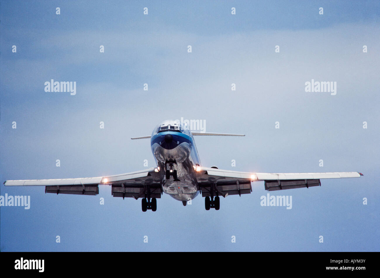 Commercial Airliner landing,blue skies, Miami International Airport Stock Photo