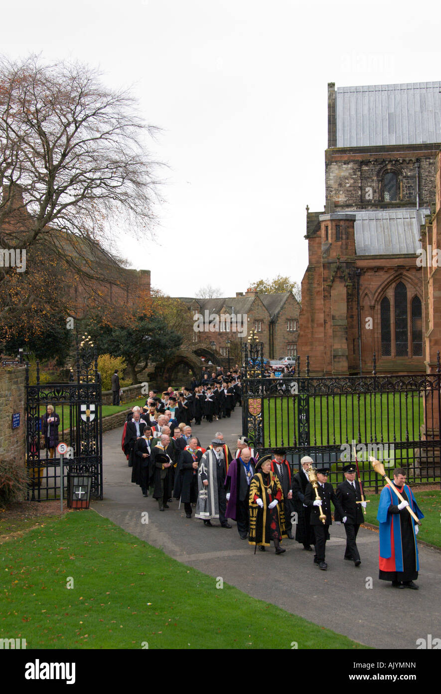 University of Cumbria students and staff procession after graduation ceremony in Carlisle Cathedral England Stock Photo