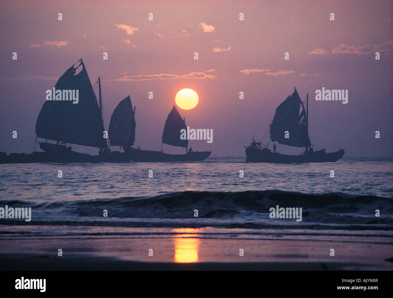 China. Guangdong (Canton). Shantou area. Dezhou Island. Early morning view of Chinese trading junks off the coast. Stock Photo