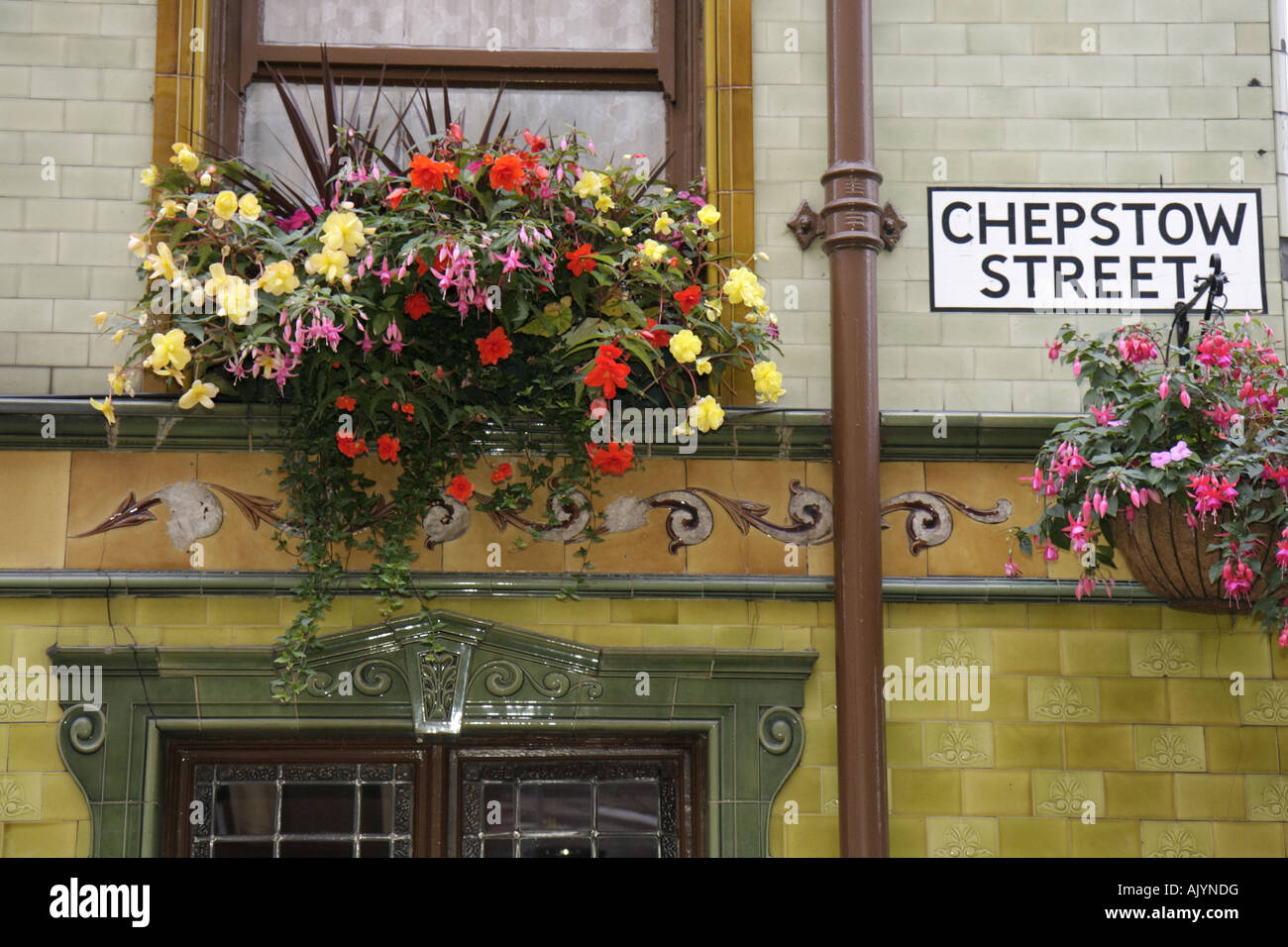UK England Lancashire,Manchester,City Centre,Chepstow Street,Wilsons Peveril of the Peak Pub,flower basket,UK071001003 Stock Photo