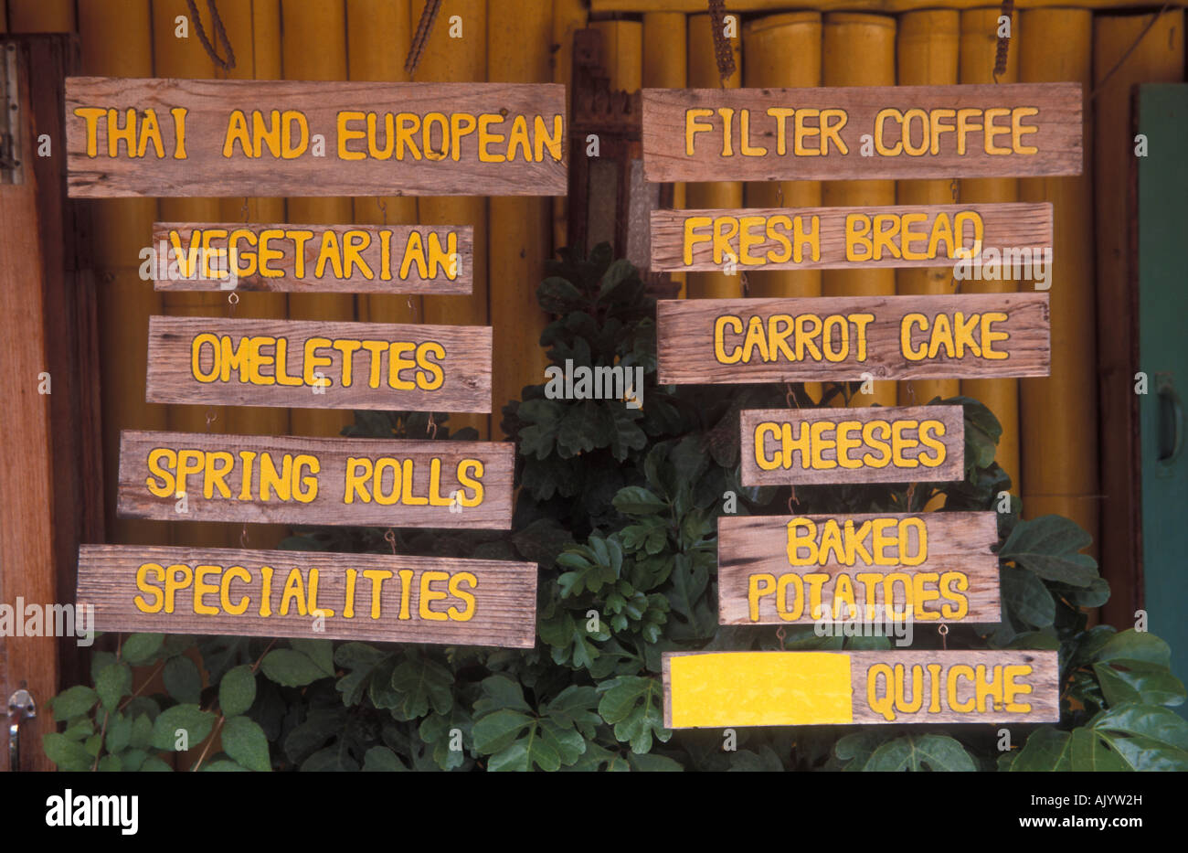 Meun signs outside a restaurant in Pai in Thailand. Stock Photo